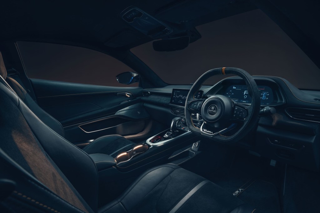 The black seats and dashboard of a UK-market 2023 Lotus Emira