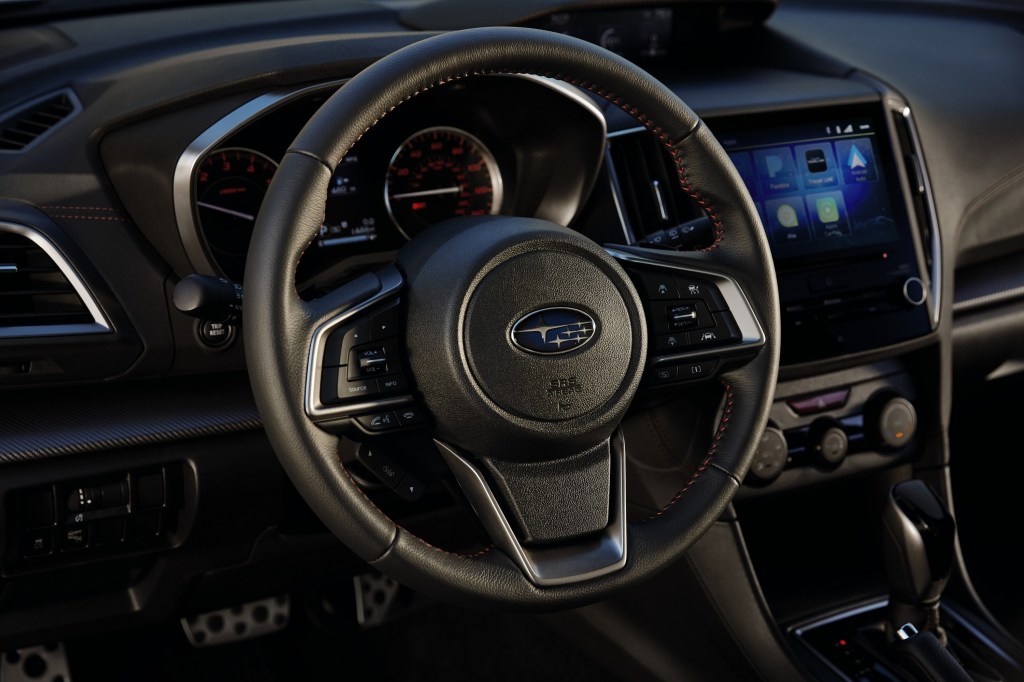 The Impreza's leather-wrapped steering wheel