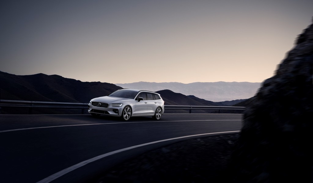 Silver Volvo V60 driving up a mountain road