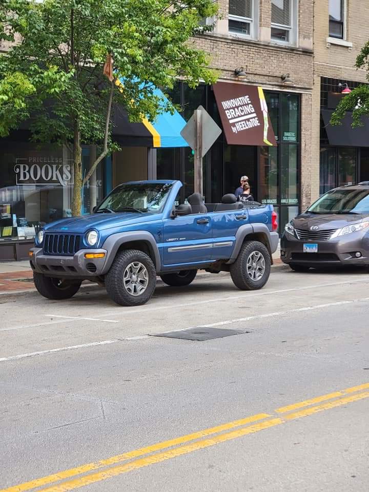 The blue convertible Jeep Liberty, made by Reddit user u/Total_Offroad_Steve