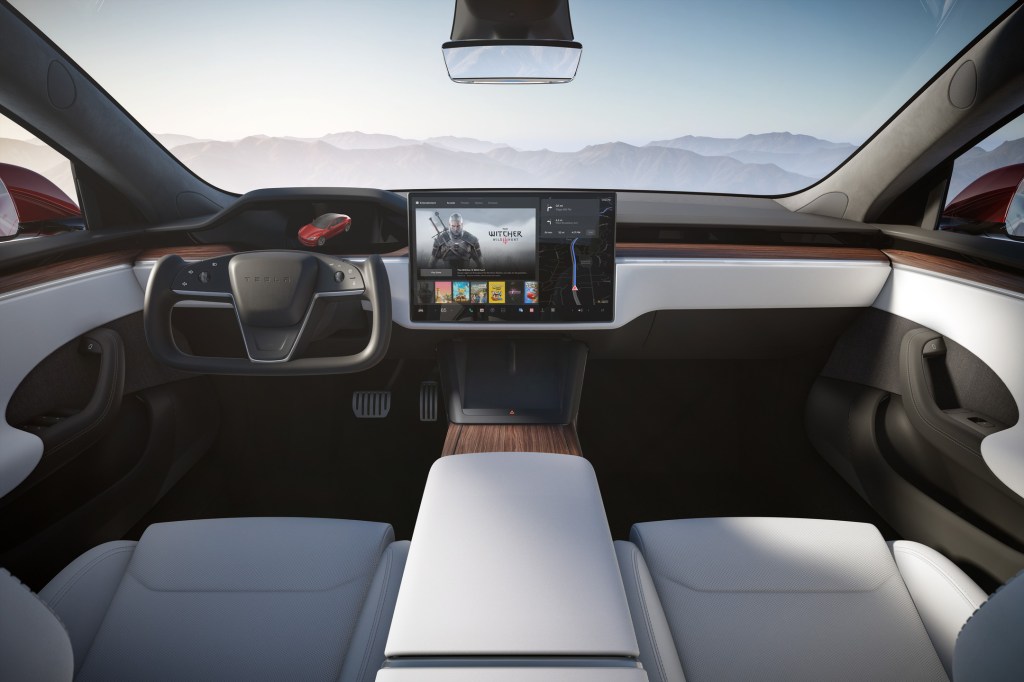 A rendering of the interior of the new Tesla Model S Plaid, complete with yoke wheel