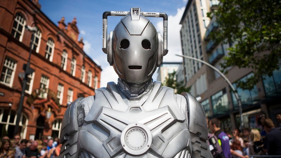 A silver cyborg in a crowd. The Tesla Cybertruck and Doctor Who Cybermen are eerily similar.