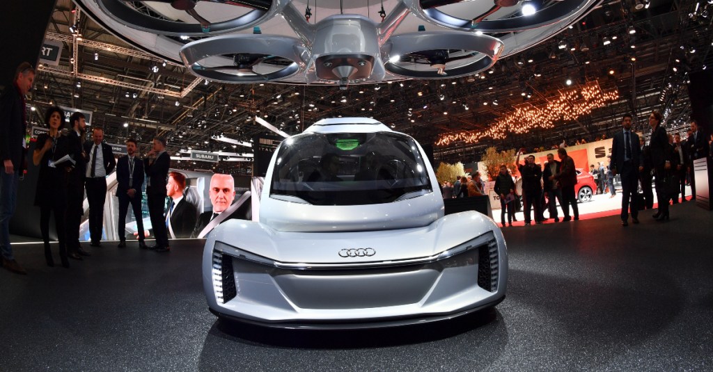 A silver Audi concept flying car. 