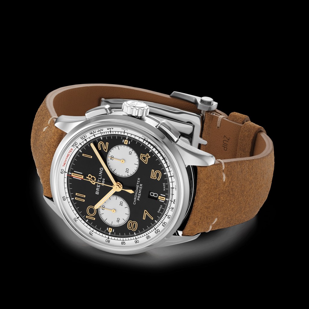 The silver-cased black-and-gold-dialed Breitling Premier B01 Chronograph 42 Norton with a brown-leather strap