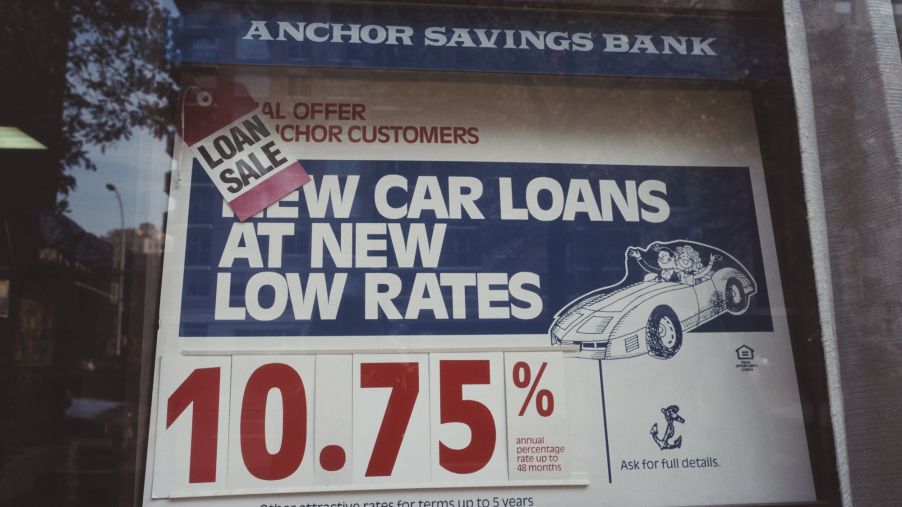 An Anchor Savings Bank with a car loans sign window