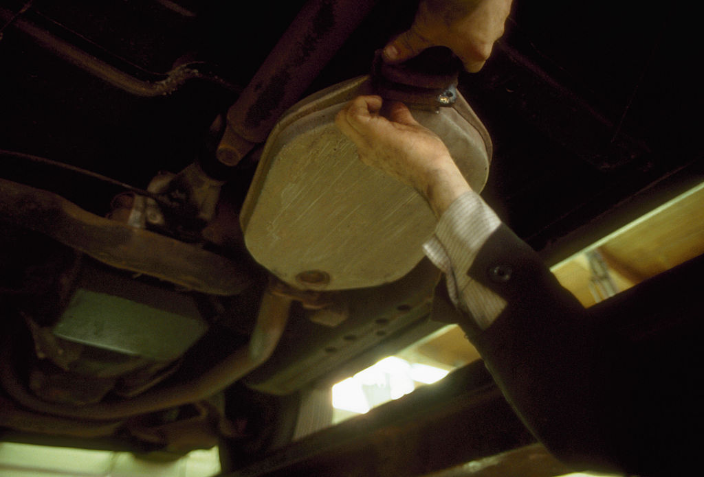 a catalytic converter being removed