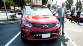 Congressman Adam Schiff plugs in his Chevy Bolt during the unveiling of new electric vehicle charging ports in Downtown Burbank on Monday, July 12, 2021.