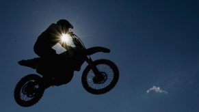A silhoutte of a motorbike is seen during the Moto Cross side car World Cup Final. Triumph is getting into motocross and enduro