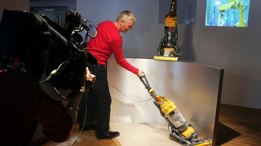 Inventor James Dyson demonstrates his latest vacuum cleaner on March 14, 2005, in London