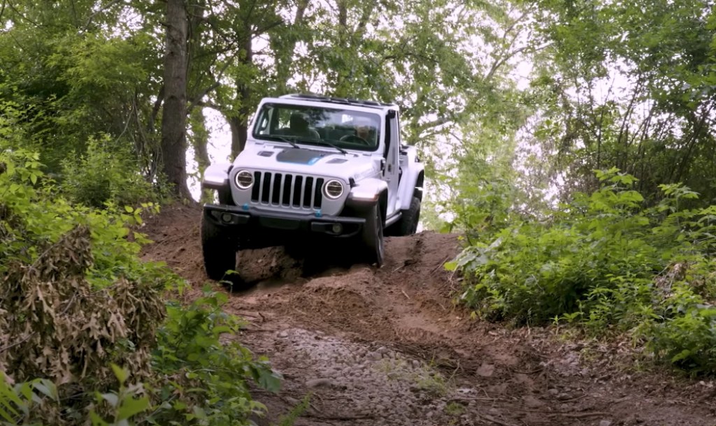 All-electric Jeep Freedom ripping through an off-road trail 