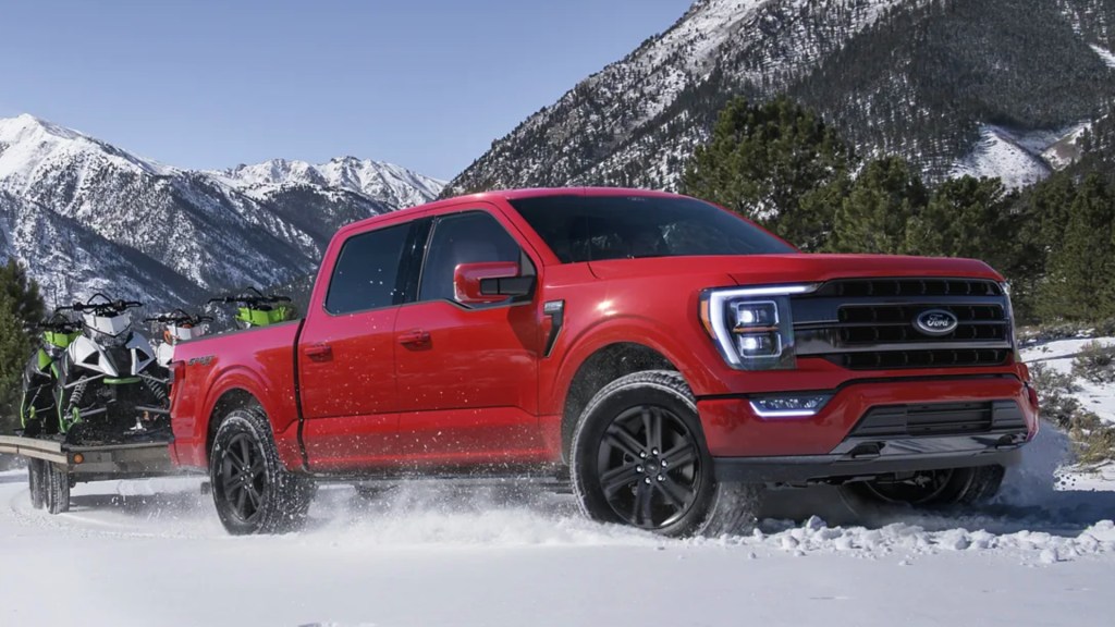 A red Ford F-150 in the snow. 