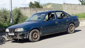 A car with a broken front bumper