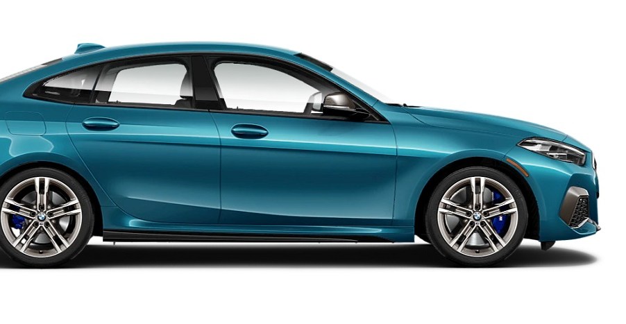 A teal 2021 BMW Gran Coupe against a white background.