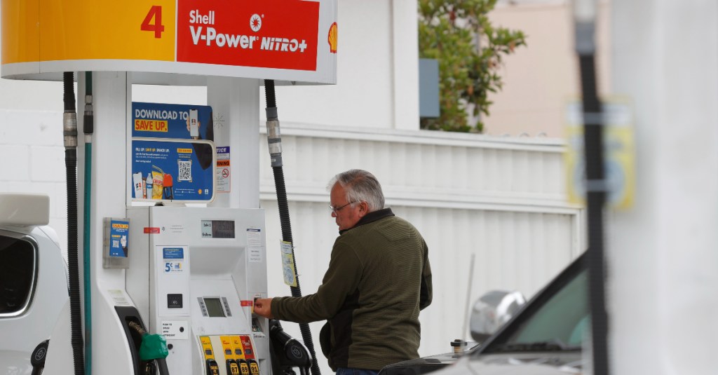 A customer prepares to pump gas at a Shell station