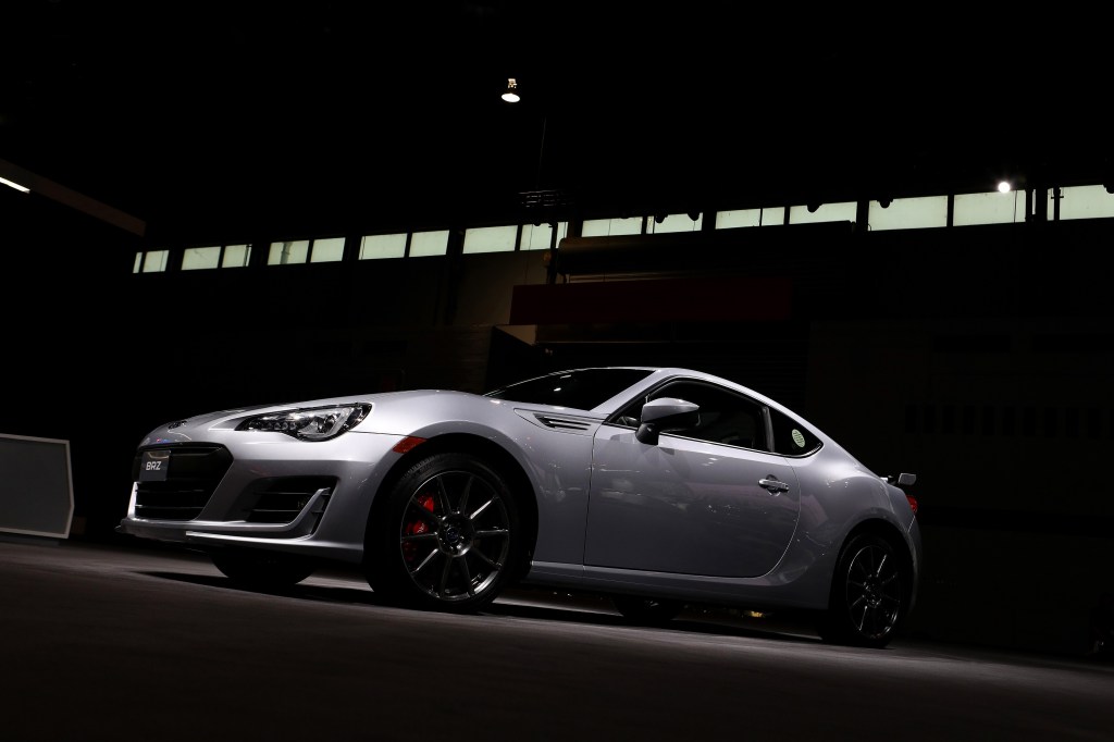 A silver BRZ under a light box in Chicago