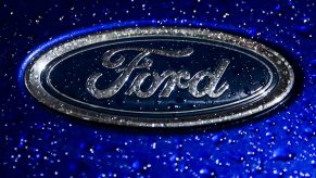 The Ford logo on one of their vehicles in the rain