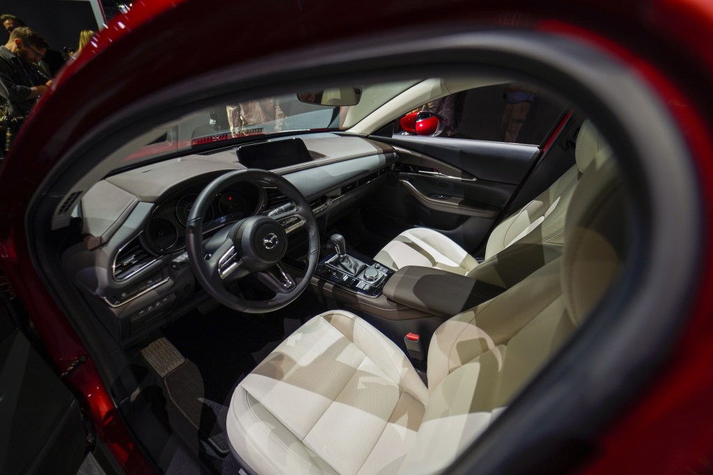 the interior of the 2021 Mazda CX-30 view from outside the driver's side looking into through the open door