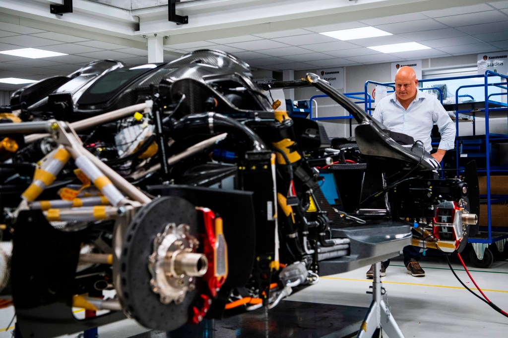 Founder Christian von Koenigsegg gazes at his Regera hypercar, still being assembled