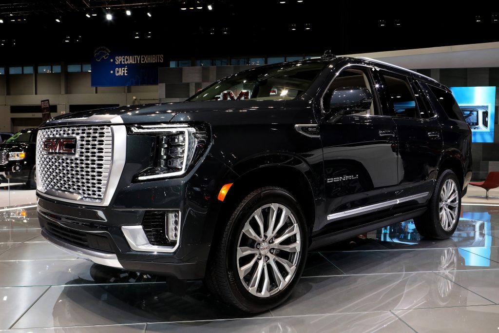 A black Yukon Denali at an auto show