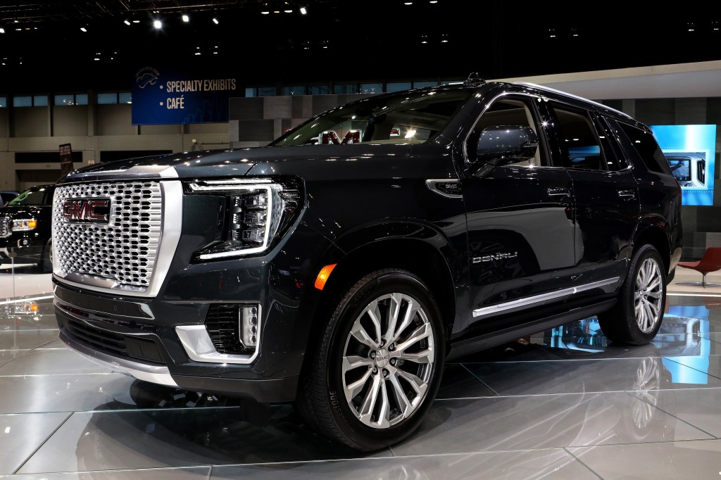 A black Yukon Denali at an auto show