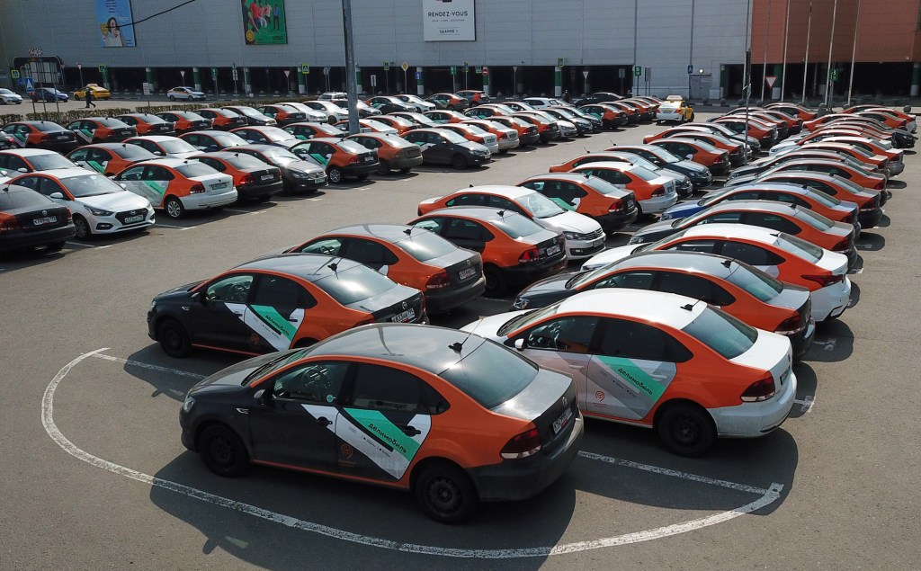 Rideshare vehicles are seen in a parking lot in Russia