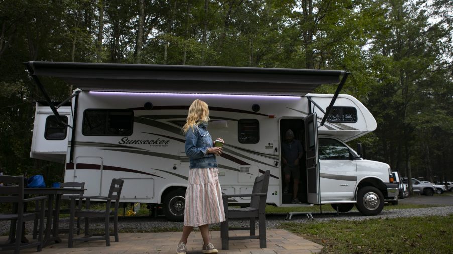 A travel writer enjoying her rented RV at a scenic camp ground