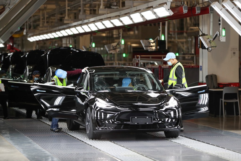 Tesla workers at the factory