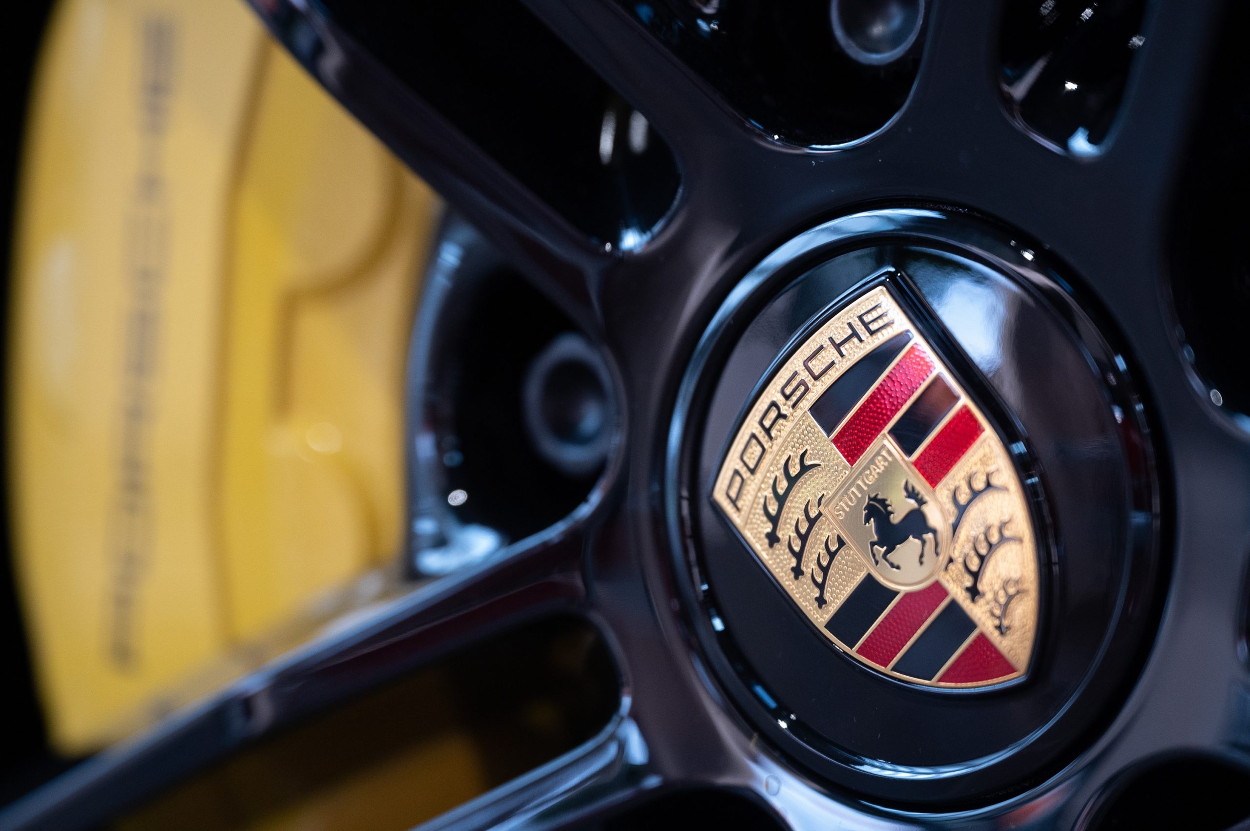 The iconic Porsche crest on the wheel of one of their models