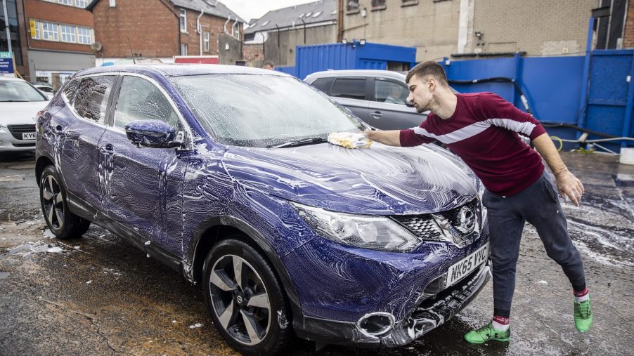 A man detailing a car in Belfast