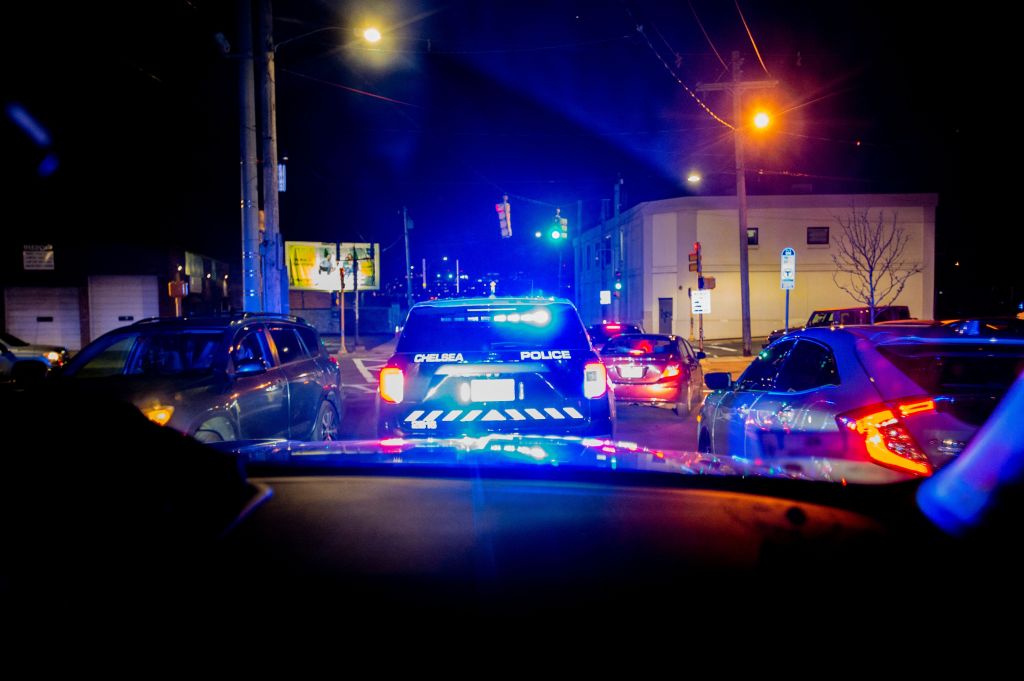 Police cars on a traffic stop at night