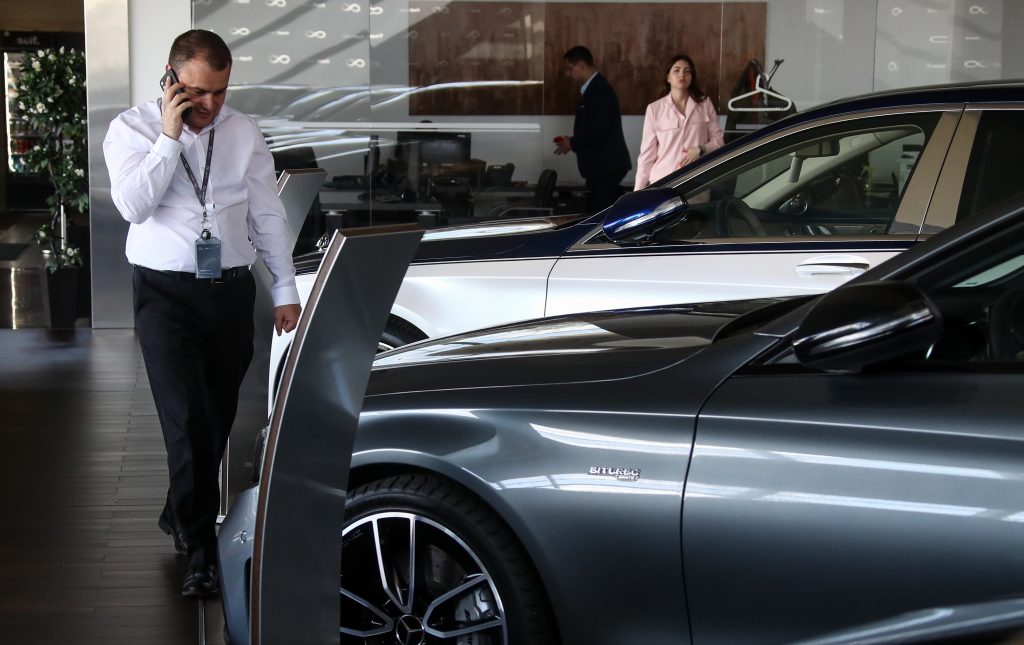 Selling cars at the Fresh Auto car dealership.