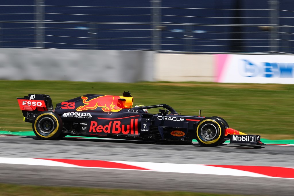 Max Verstappen's F1 car racing on-track during qualifying at the Austrian Grand Prix
