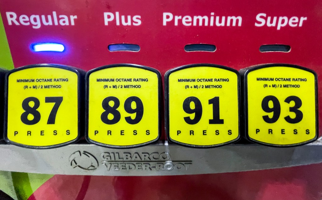 Gas prices are displayed at a pump