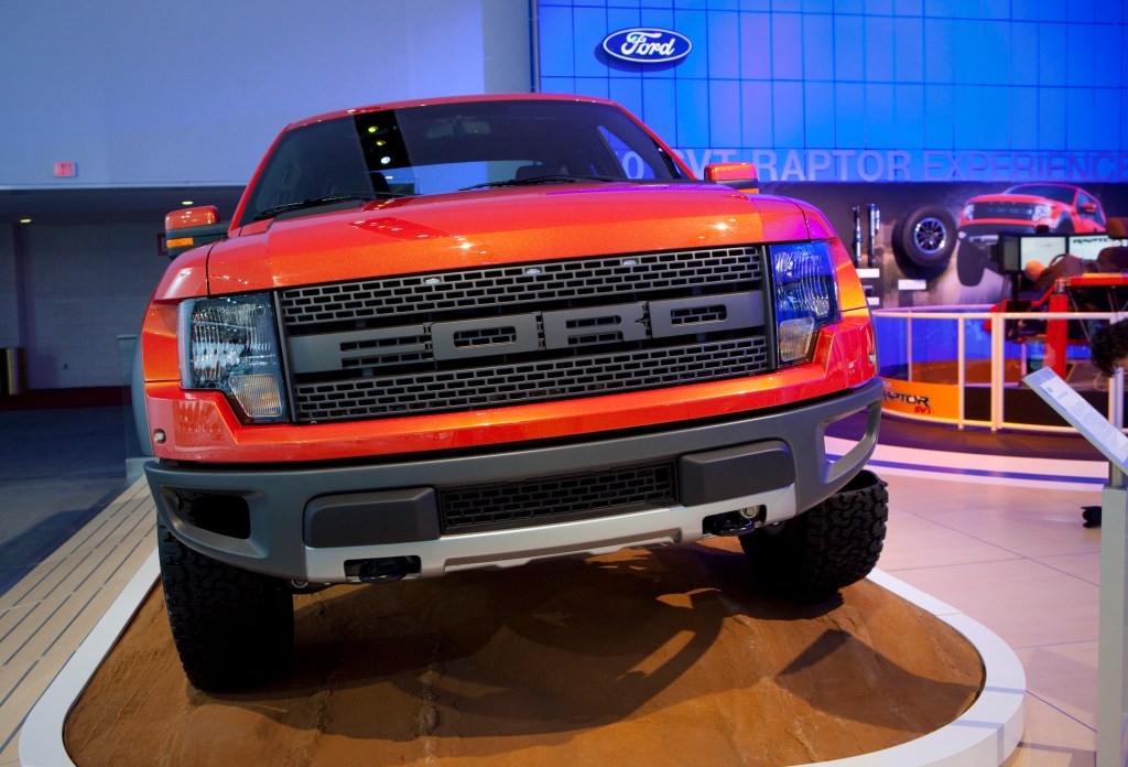 An orange Ford F-150 Raptor in 2009 ahead of its debut at an auto show