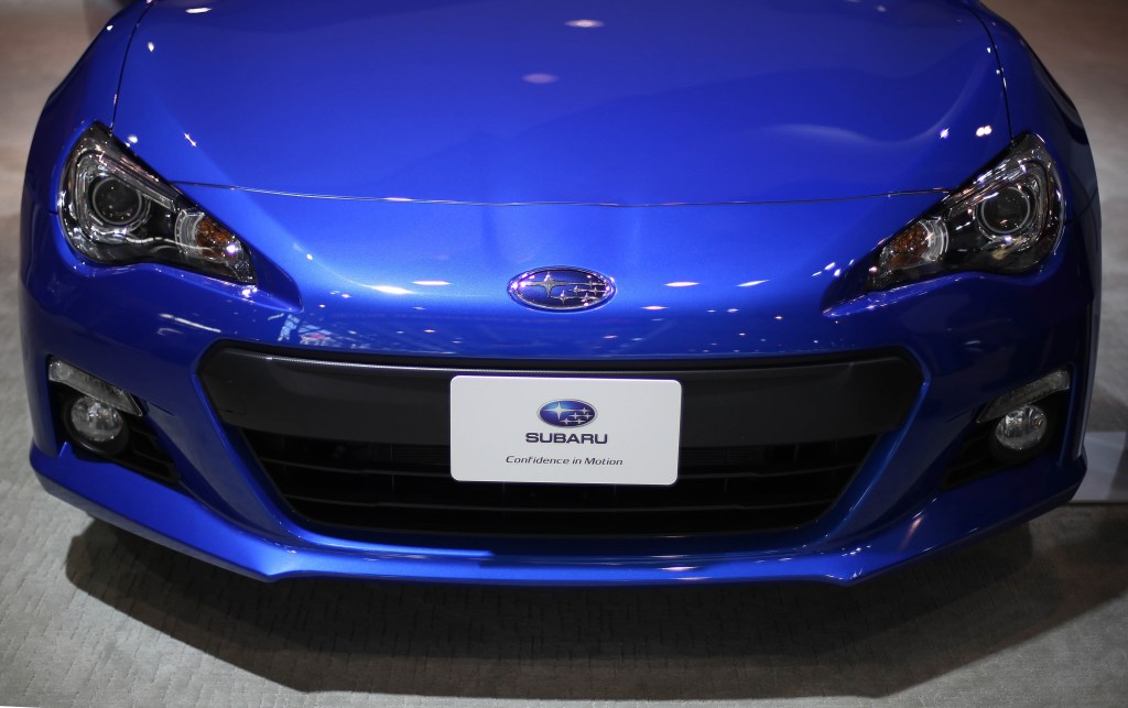 A the front end of a blue Subaru BRZ 