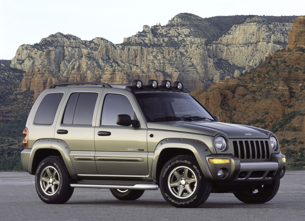 A silver 2003 Jeep Liberty Renegade on a mountain pass