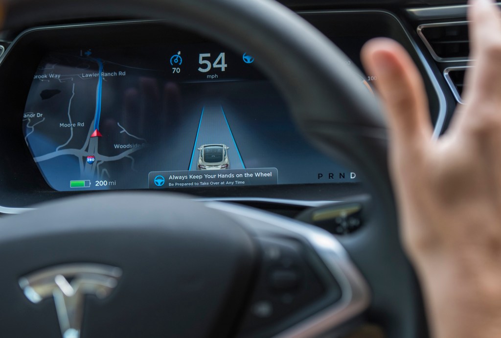 The display of a Model S sedan while Autopilot is active.