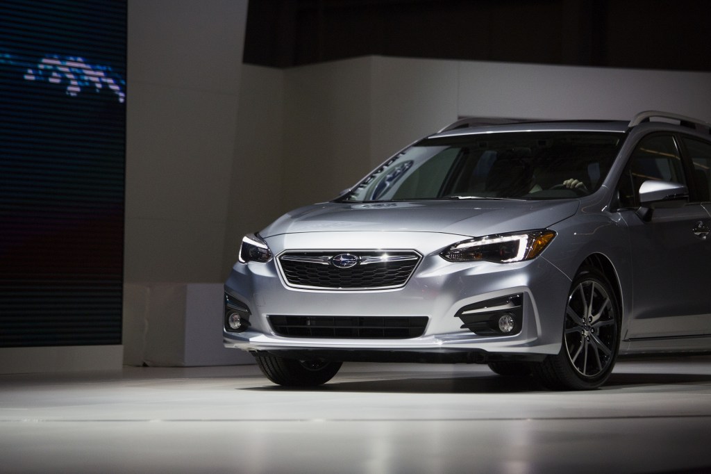 A silver Subaru Impreza wagon on stage at the N.Y. Auto Show