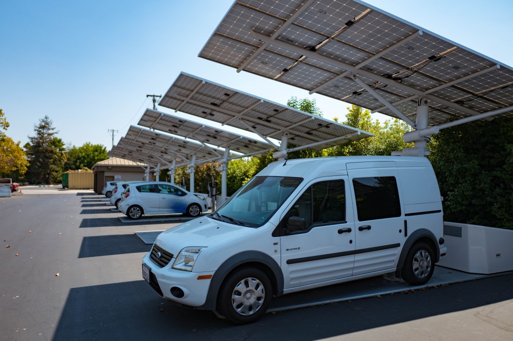EVs and Hybrids plugged into a solar car charger.