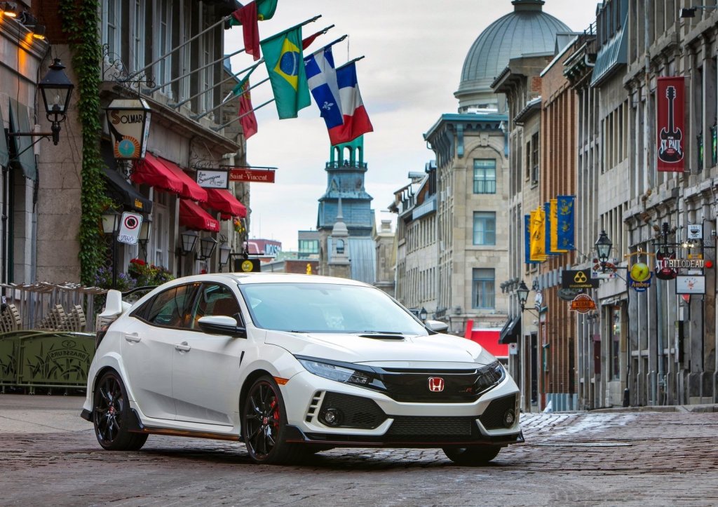 a white Honda Civic Type R in the city 