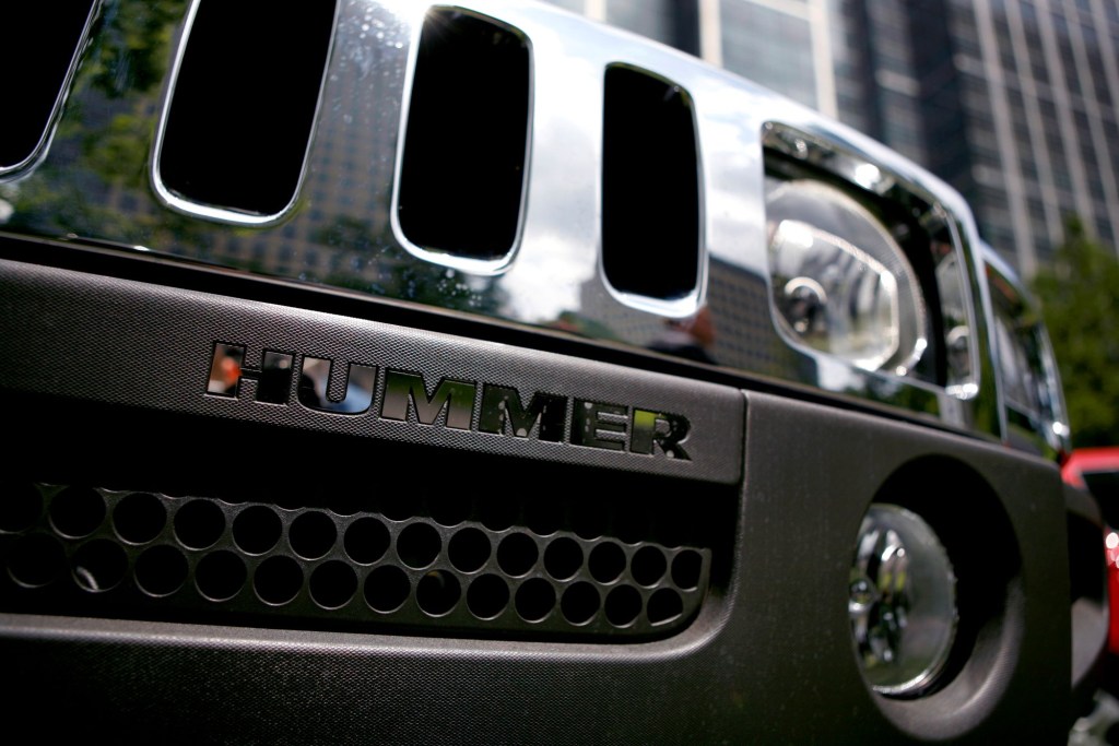 Close shot of older Hummer grille with Hummer spelled out under the main part of the grille.