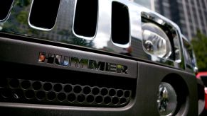 Close shot of older Hummer grille with Hummer spelled out under the main part of the grille.