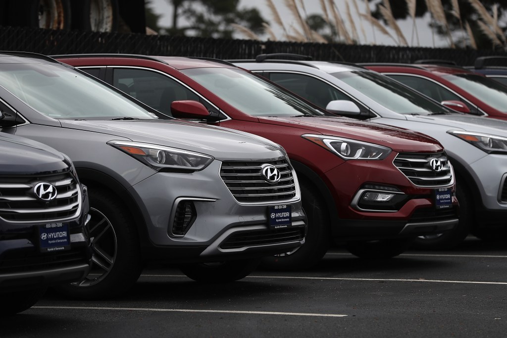 A row of Hyundai cars on a sales lot