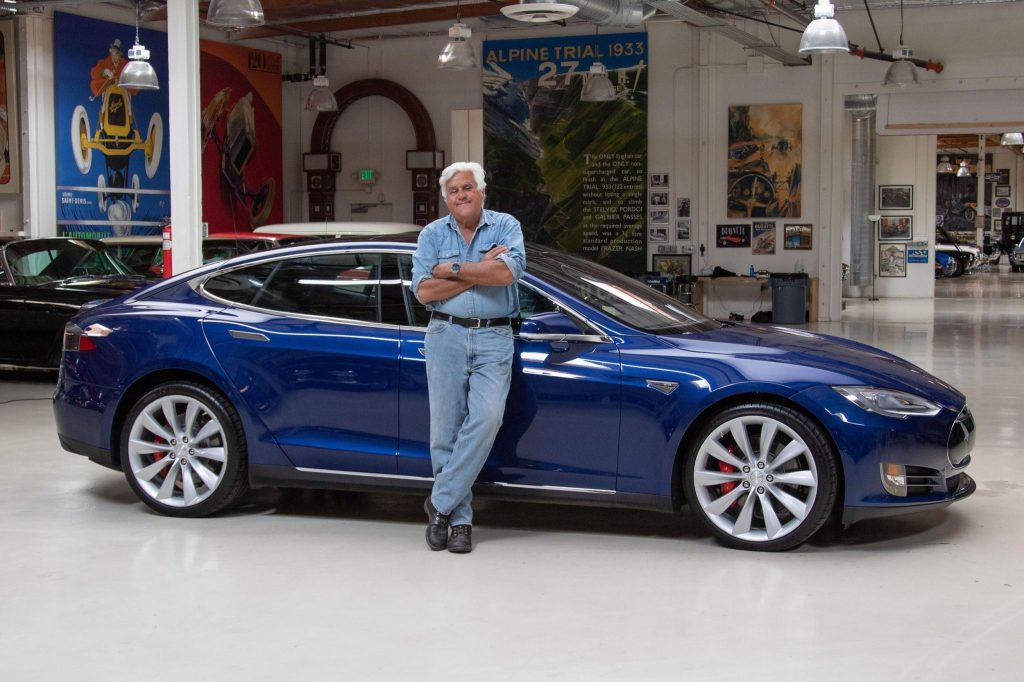 Jay Leno with his blue Tesla Model S