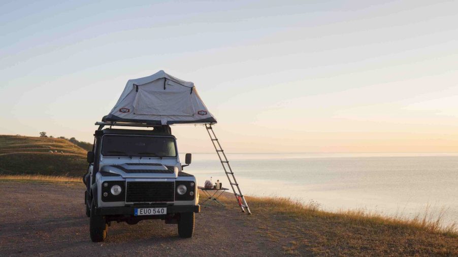 Off-road four-wheel drive vehicle with rooftop tent prove that having the best SUV for the beach is strong move