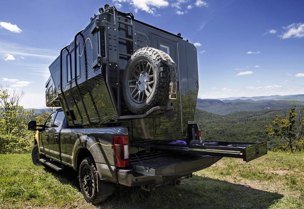 Loki Falcon truck camper top from behind parked in the mountains