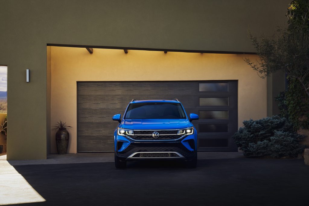 2022 Volkswagen Taos in from of an adobe-style house