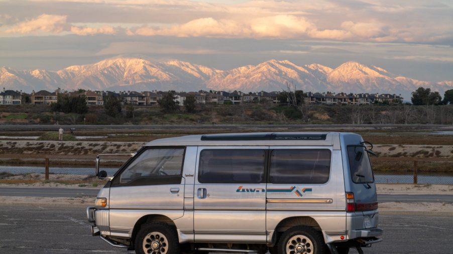 This 1992 Mitsubishi Delica parked in front of a So Cal Moutnain range is a vintage JDM camper van for the ages.