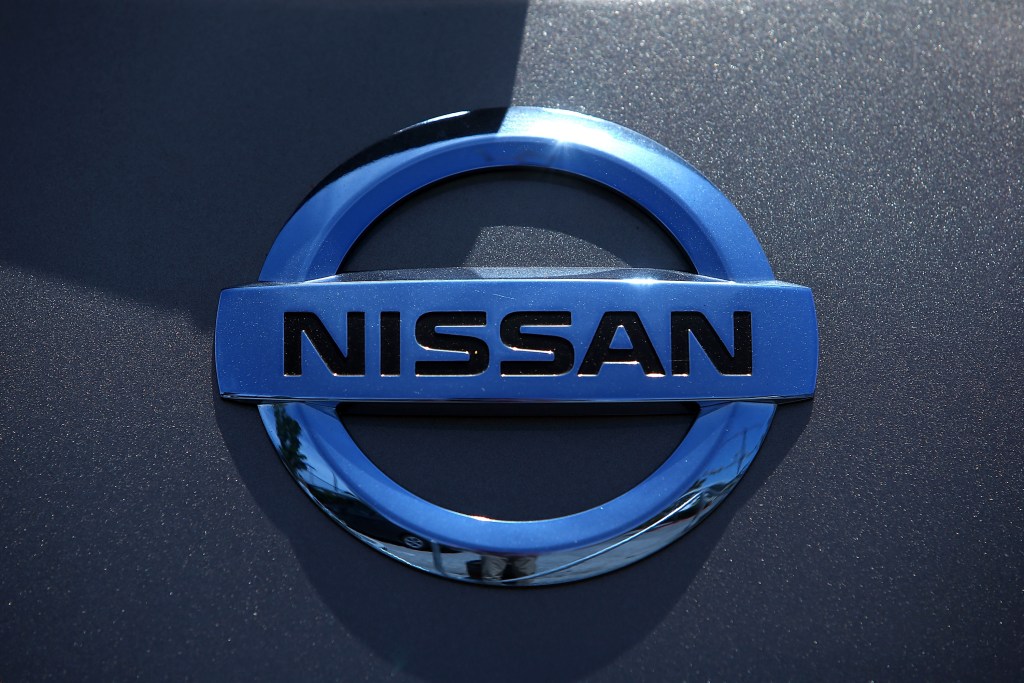 Chrome Nissan logo on a charcoal hood