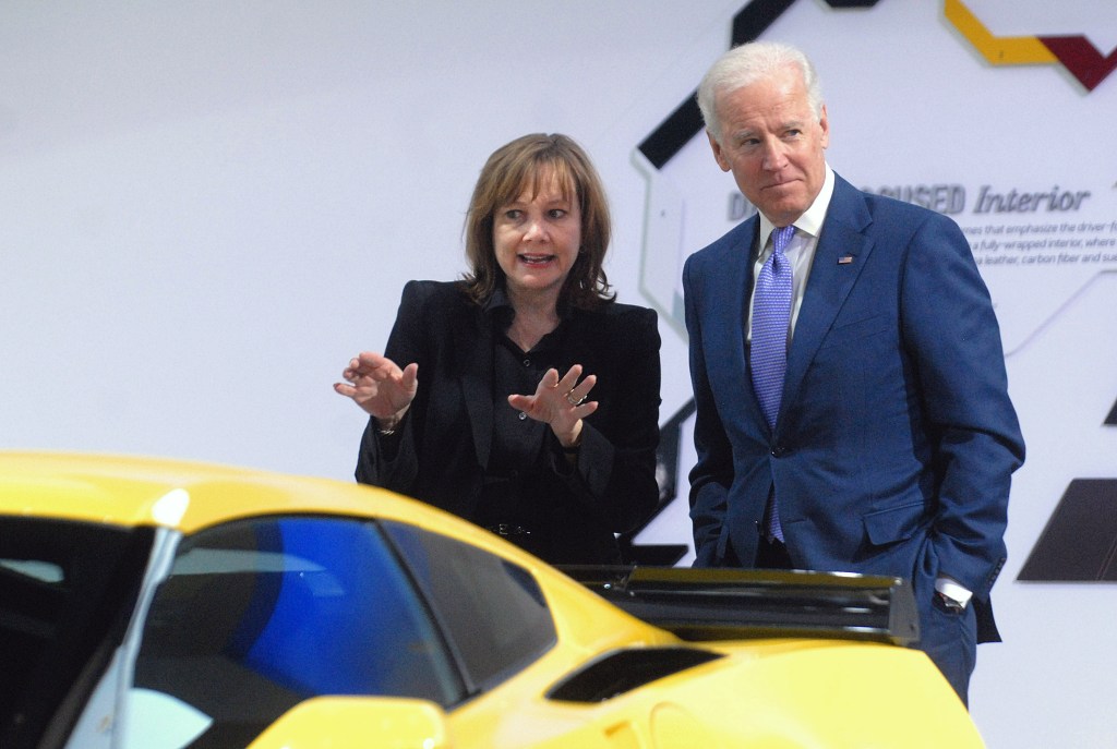 President Joe Biden and GM CEO Mary Barra looking at yellow Corvette